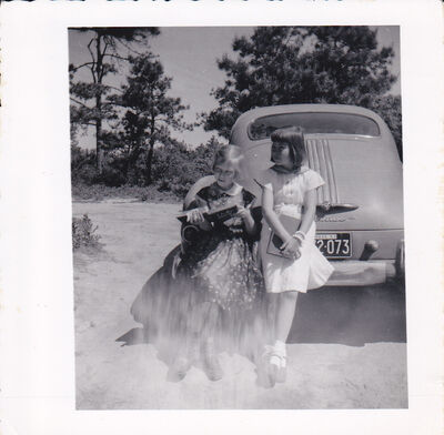 1957 Lauri and Judy w Pontiac
