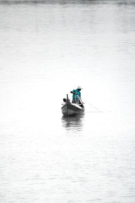 A Man Holding a Fishing Net
