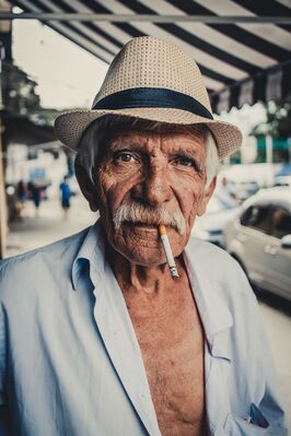 Keywords: old man,hat,smoke,cigrette