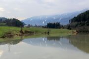 Landscape_Photography_of_Green_Grass_Field_Near_River.jpg